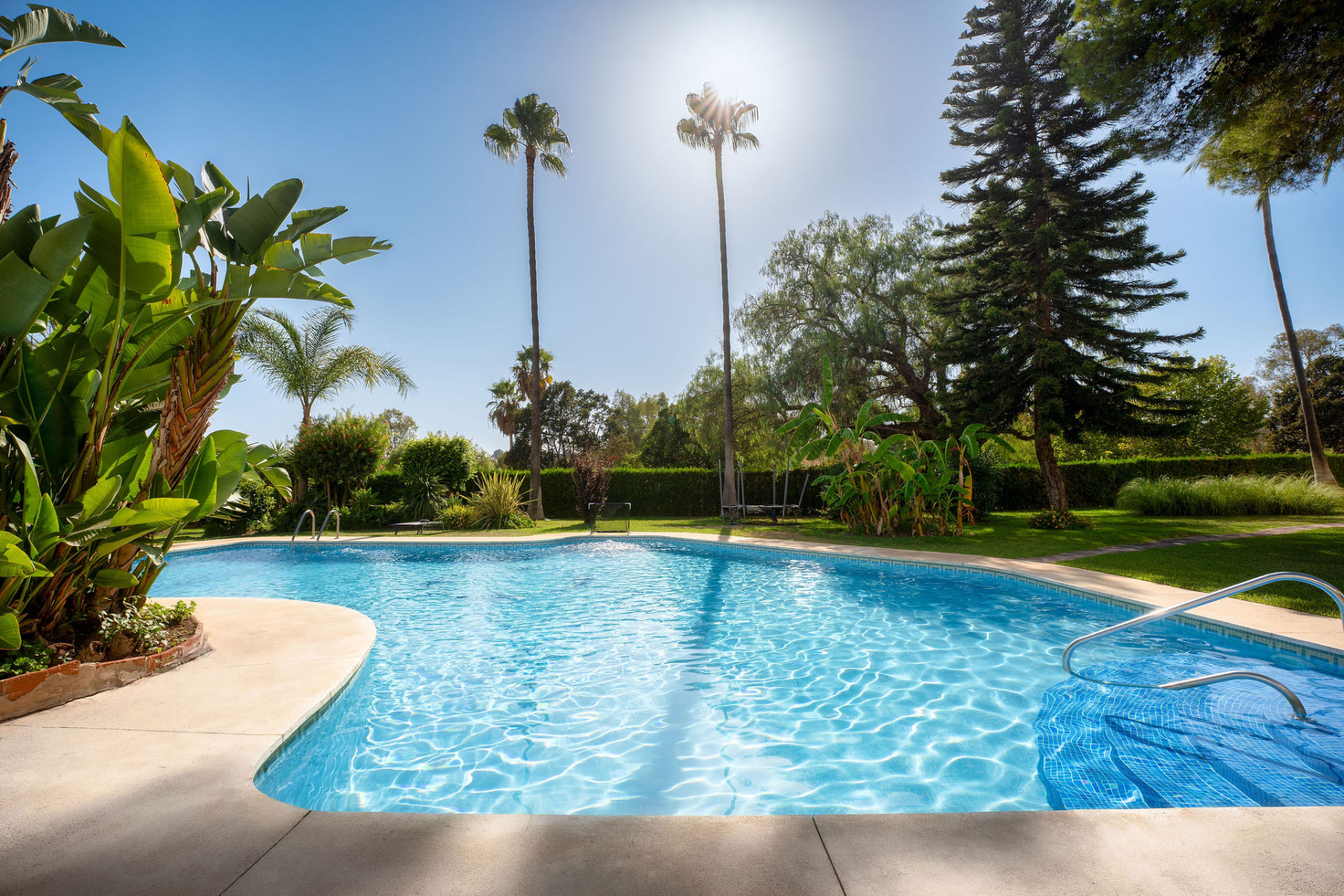 Pool and mature gardens at the Soleuropa Golf residence in Marbella